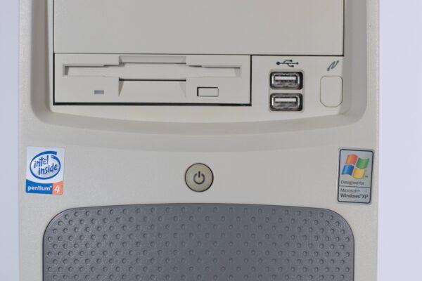 Gateway 500SE PC showing the Intel and WIndows stickers, plus power button, floppy disk drive and front usb ports.